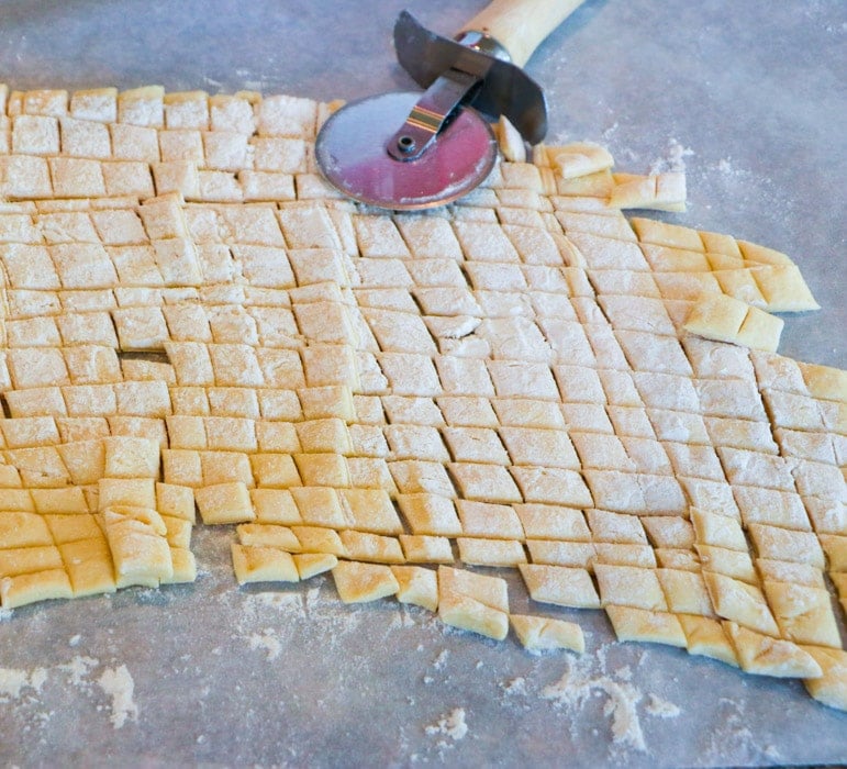 Crescent dough cut into small squares.