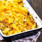 Scalloped potatoes with ham in a baking tray