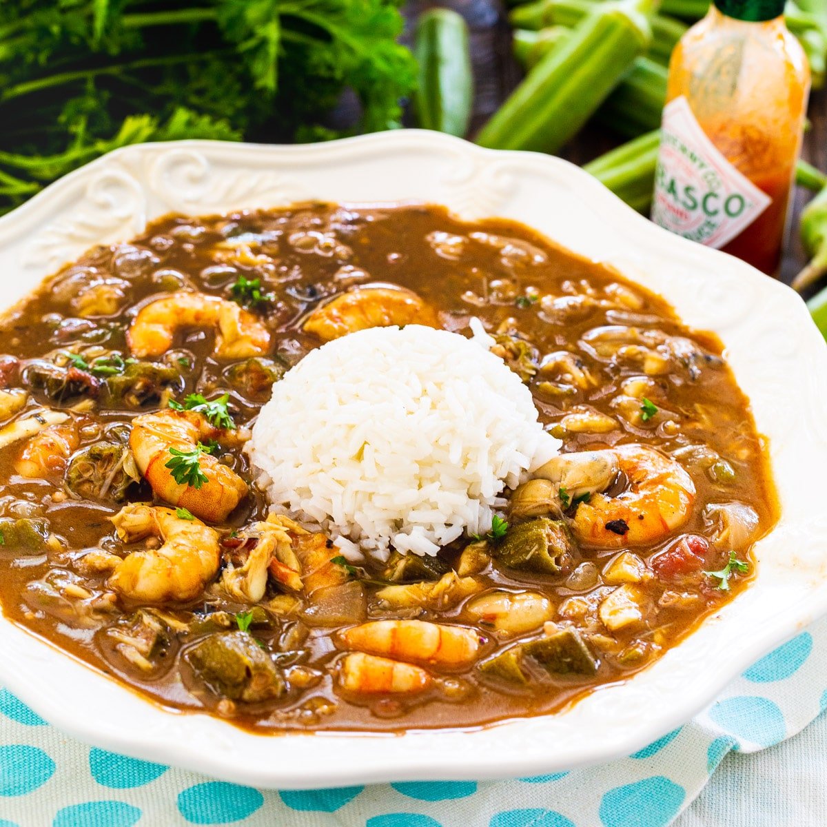 Bowl full of Seafood and Okra Gumbo with mound of rice.