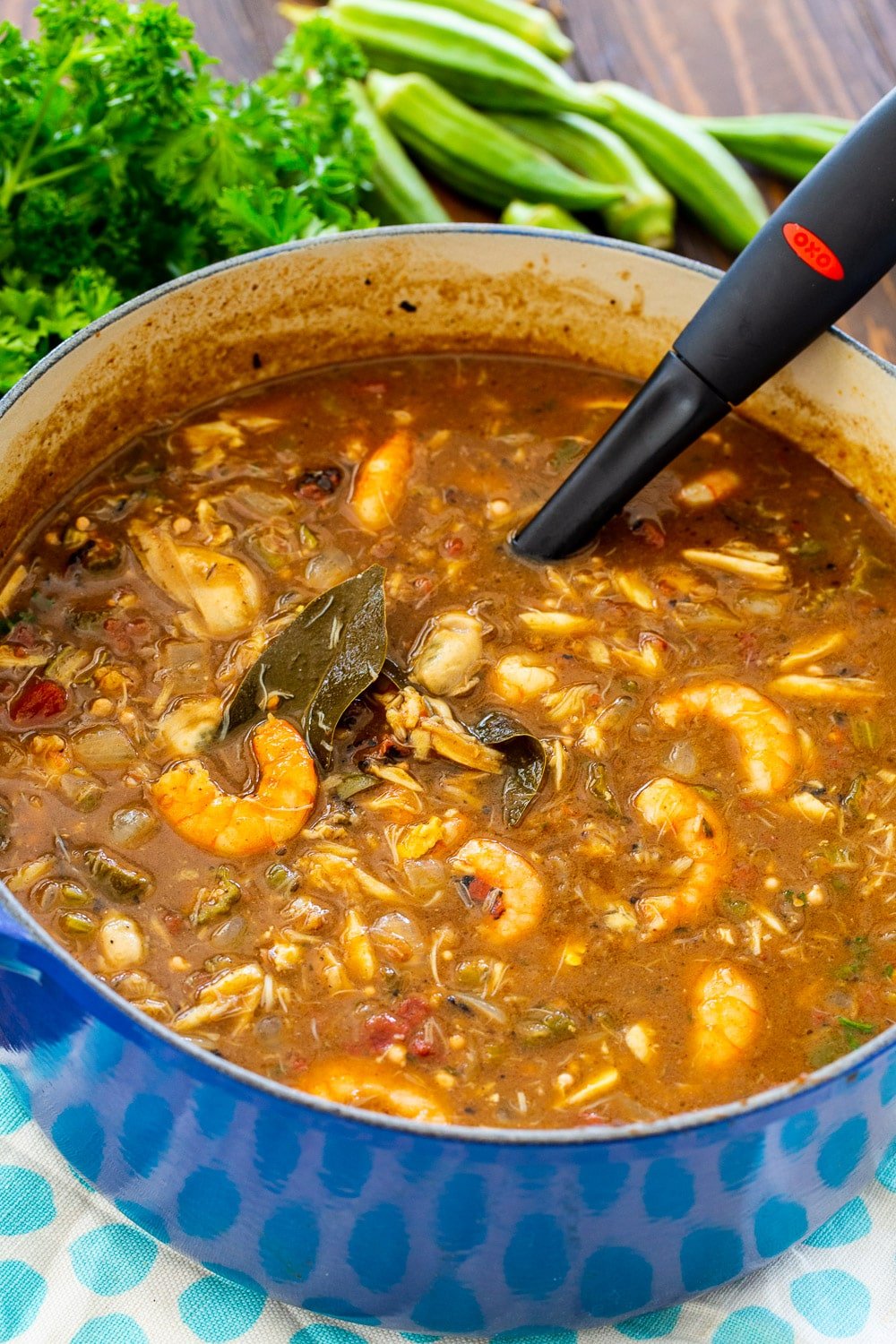 Pot full of seafood gumbo.