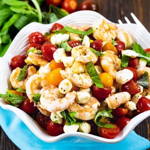 Marinated Shrimp, Tomato, and Mozzarella Salad in white serving bowl.