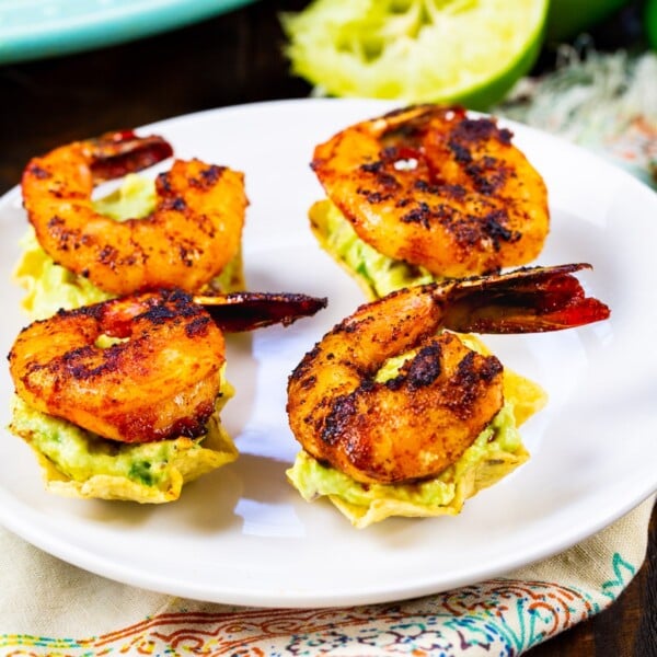 Four Shrimp Tostada Bites on a plate.