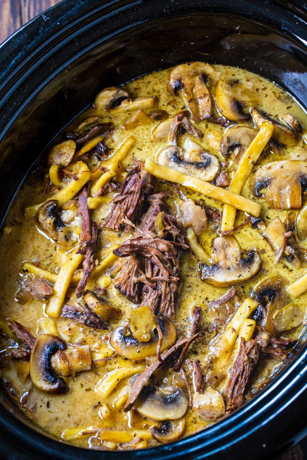Beef and Noodles with Mushrooms in a crock pot.
