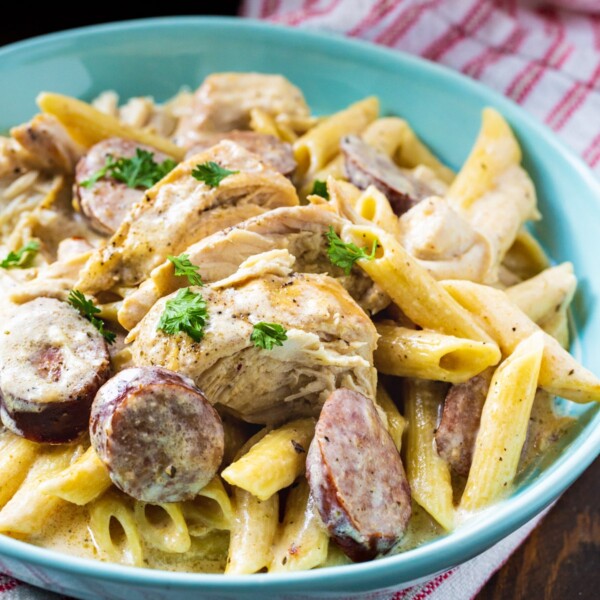 Slow Cooker Cajun Chicken Alfredo in a blue bowl.