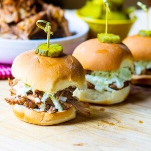 Slow Cooker Carolina-Style Pulled Pork on slider buns with slaw.