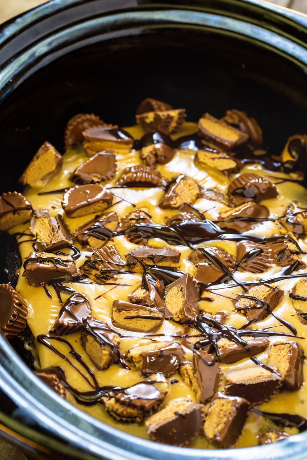 Chocolate Peanut Butter Cake topped with peanut butter frosting and chopped peanut butter cups.