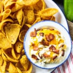 Jalapeno Dip on a plate with corn chips.