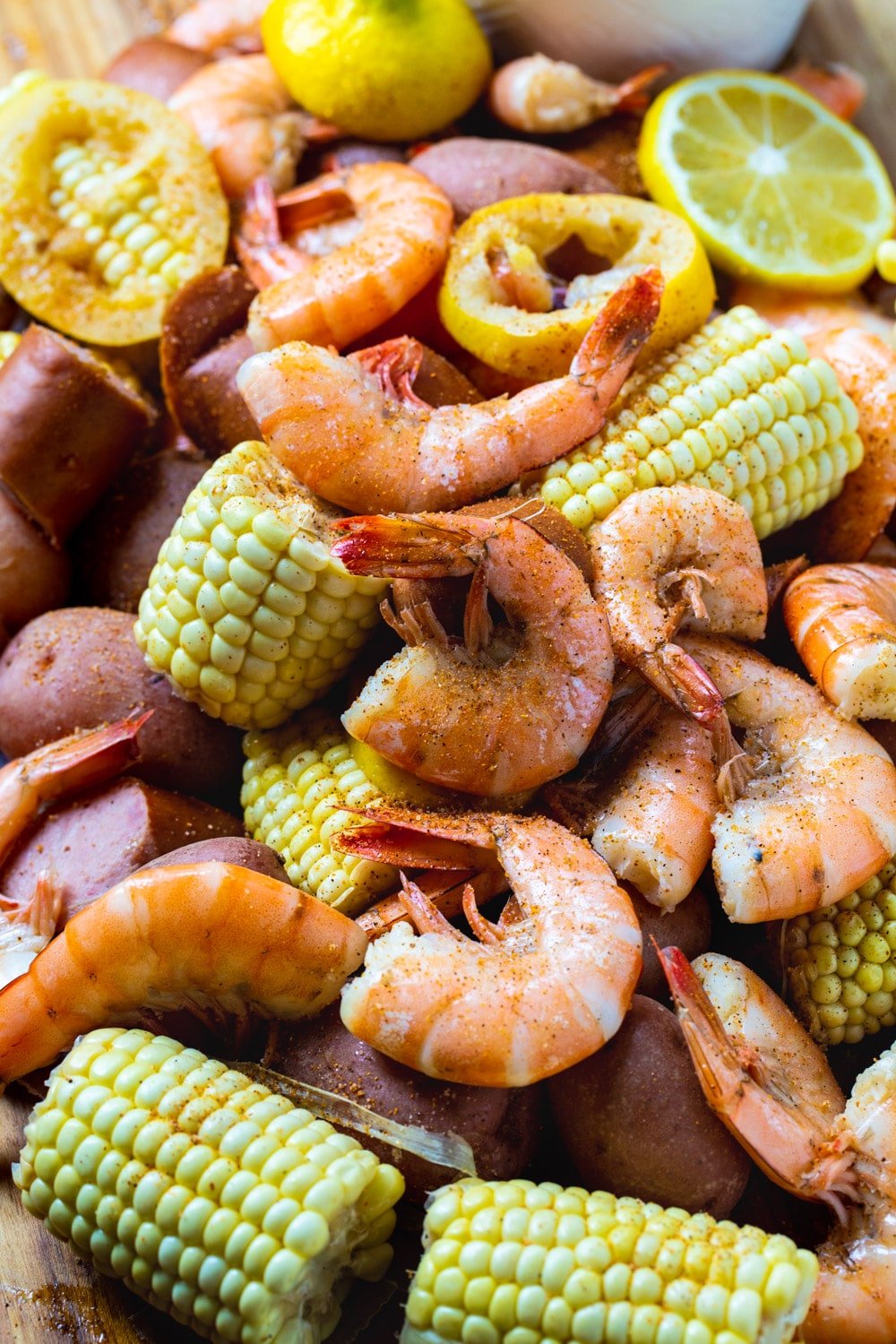 Close-up of Slow Cooker Low Country Boil spread out on a table.