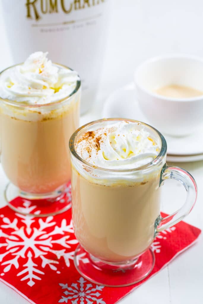 Rumchata White Hot Chocolate in two glasses topped with whipped cream.