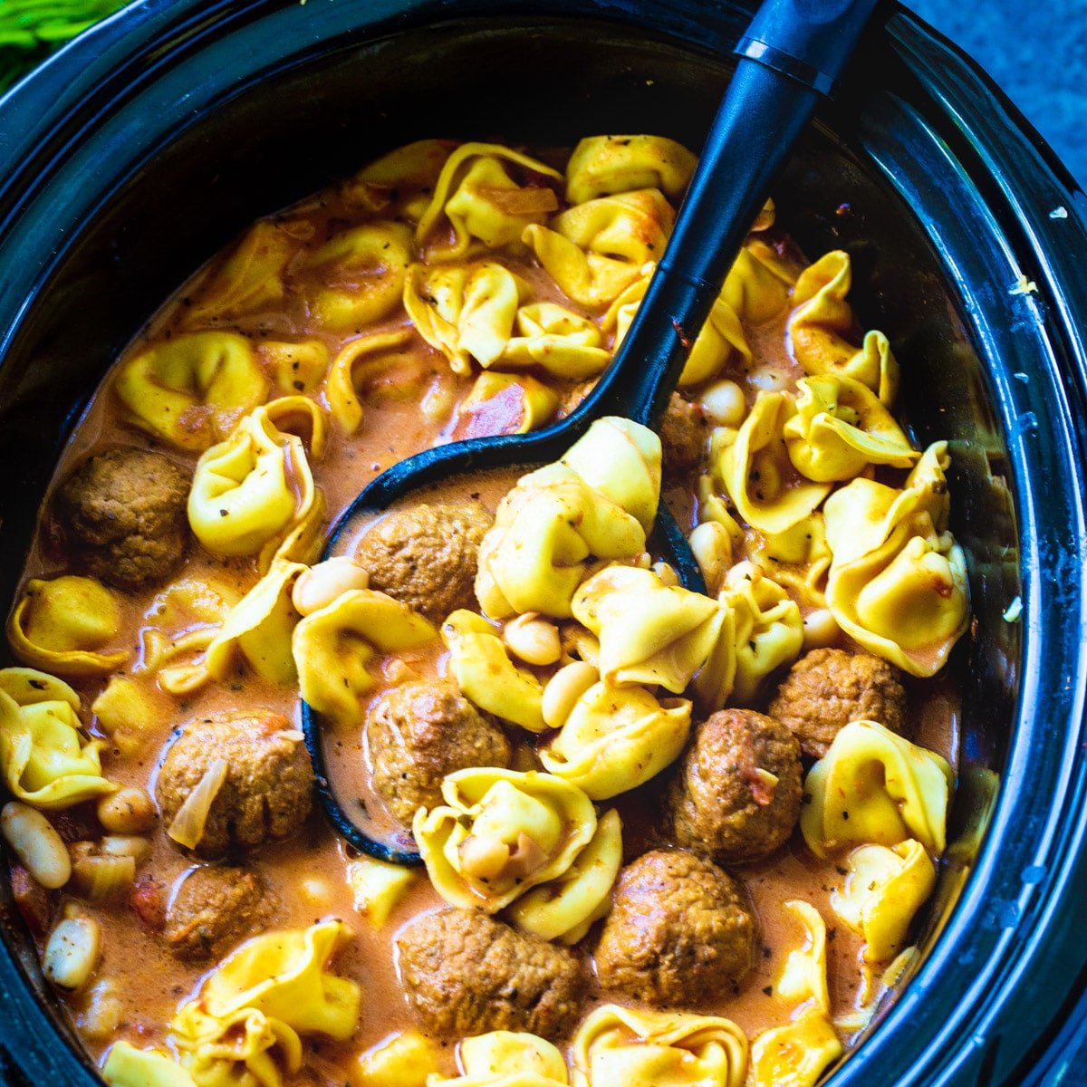 Slow Cooker Meatball and Tortellini Soup in a slow cooker.