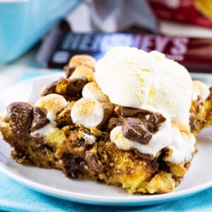 Piece of S'mores Bread Pudding topped with ice cream.