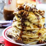 Stack of Snickers Pancakes on a plate.
