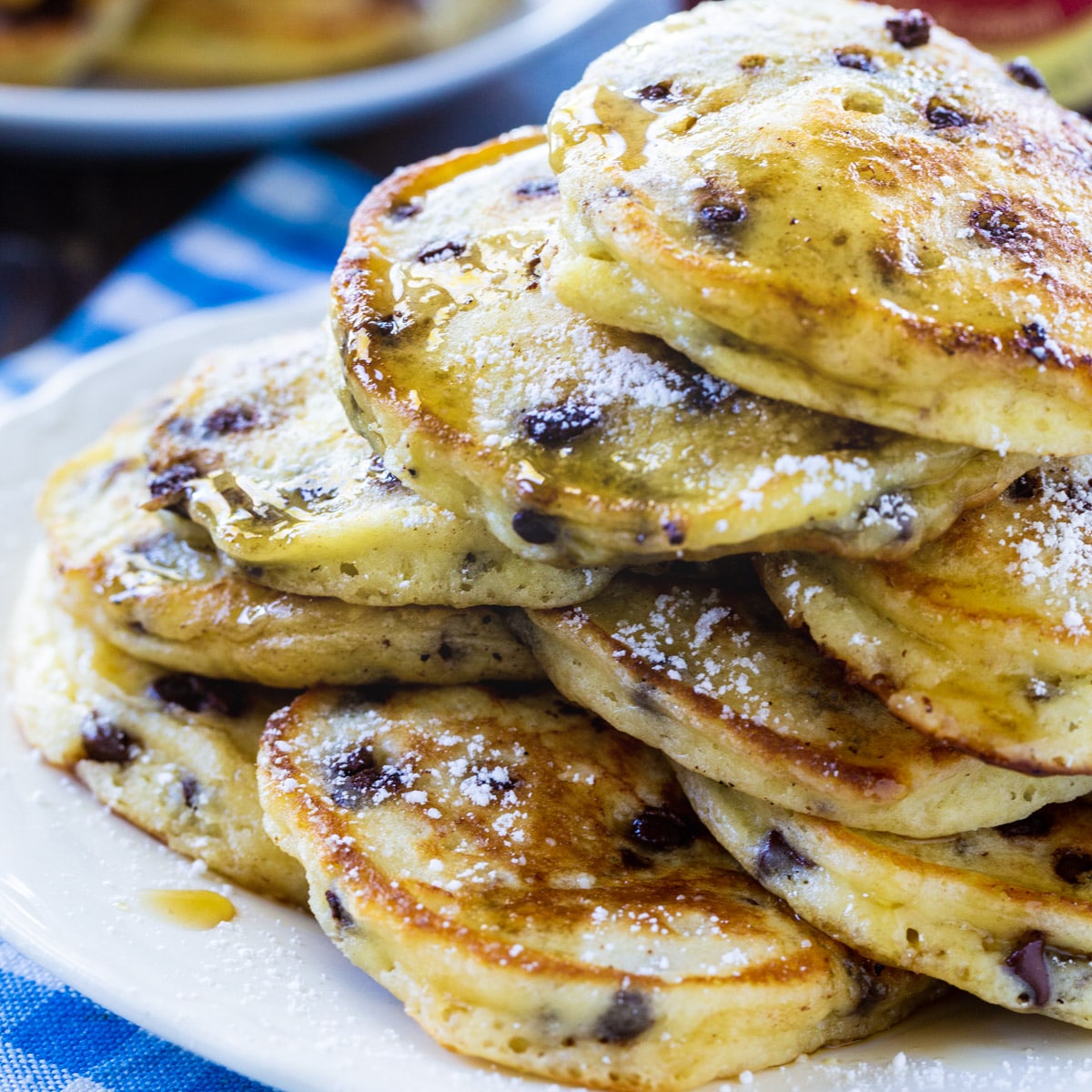 Sour Cream Mini Chip Pancakes piled up on a plate.