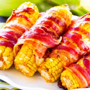 Spicy Bacon Wrapped Corn on a serving platter.