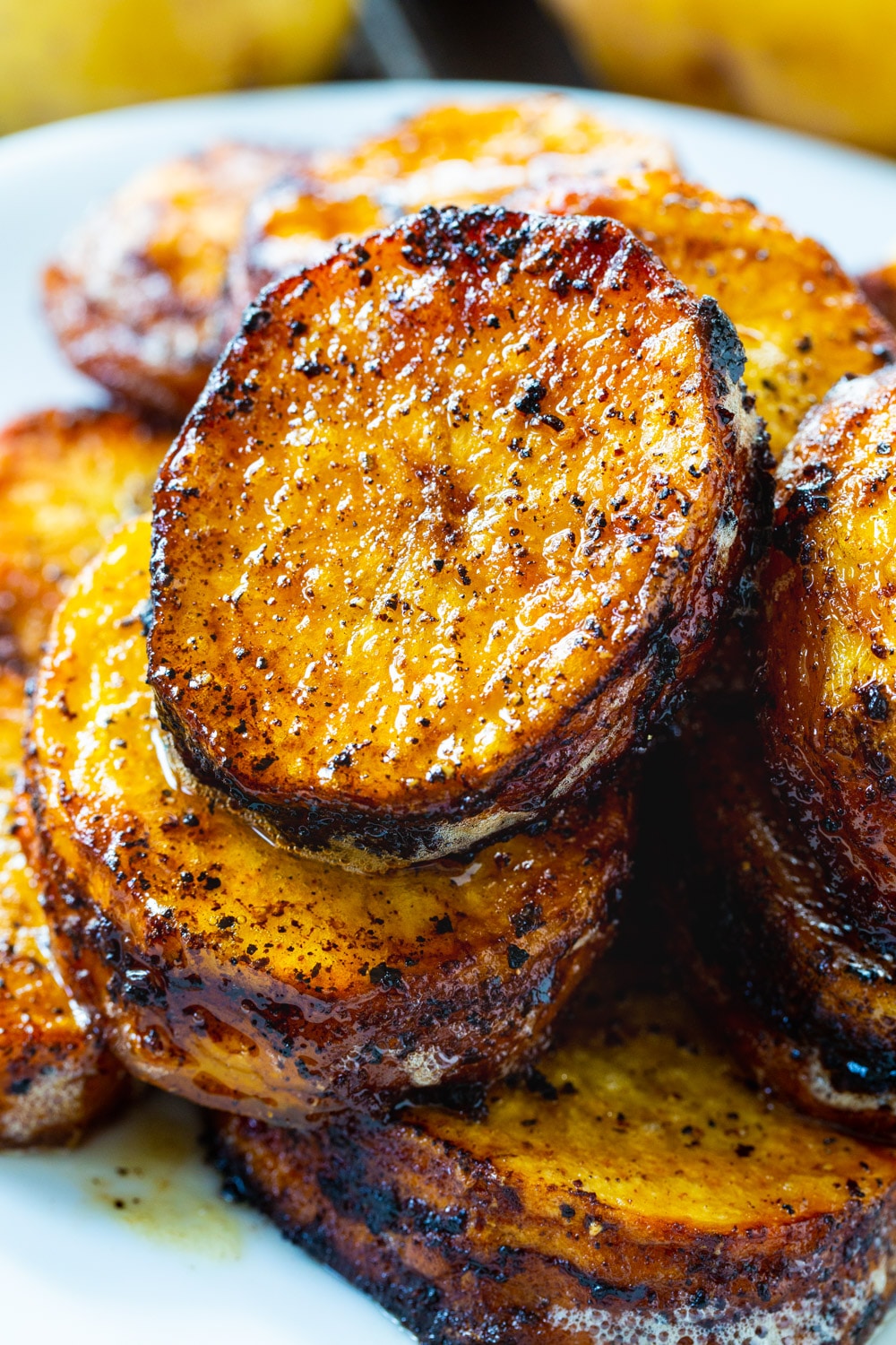 Melting Potatoes stacked on a plate.