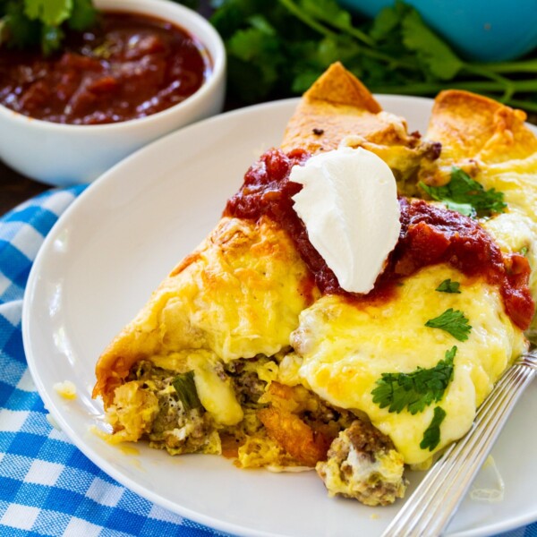 Two Spicy Sausage Breakfast Enchiladas on a plate.