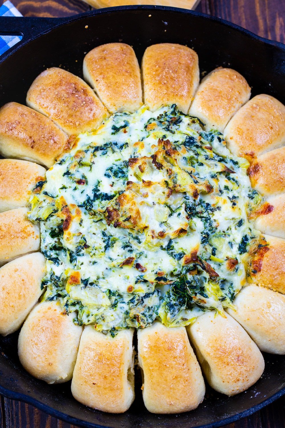 Spinach Artichoke Dip Bread Ring in a cast iron skillet.