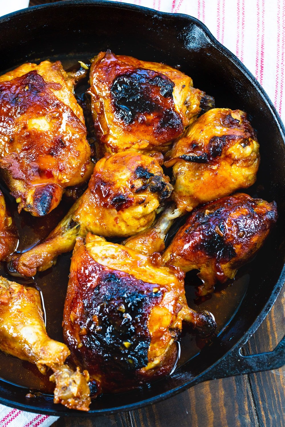 Cooked chicken in a cast iron pan.