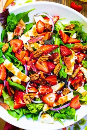 Strawberry Fields Salad in a large white serving bowl.