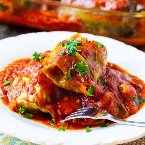 Three Stuffed Cabbage Rolls on a plate.