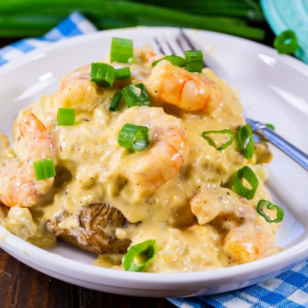 Double Stuffed Potatoes with Cheesy Seafood Sauce on a plate.