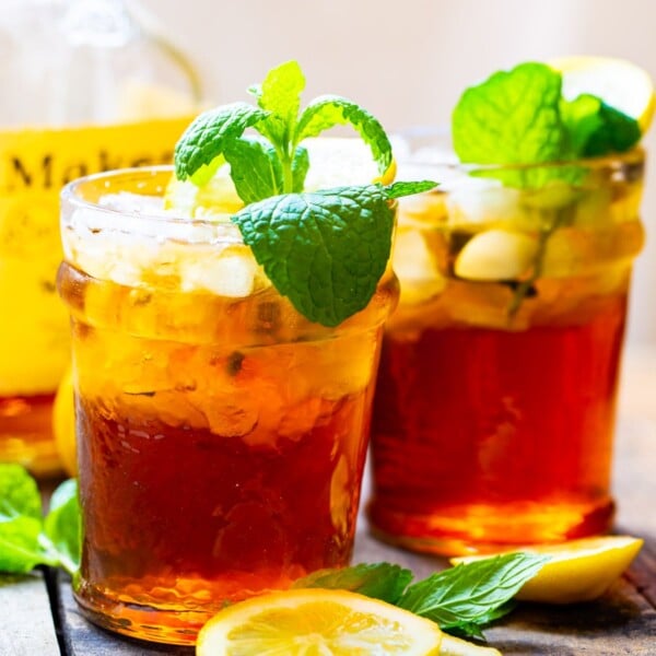 Two Sweet Tea Mint Juleps with mint sprigs.