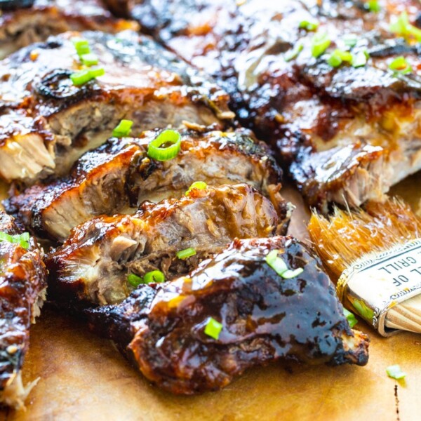 Ribs on a wooden cutting board.