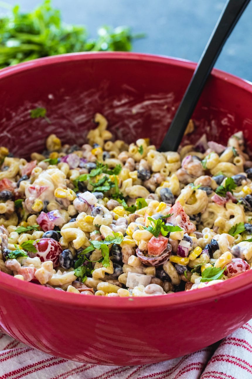 Texas Caviar Pasta Salad in a large red bowl.
