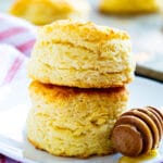 Two Tupelo Honey Biscuits stacked on a plate.