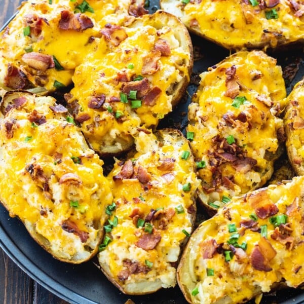 Twice Baked Potatoes on a round baking sheet.