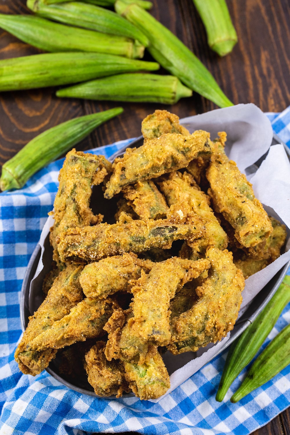 Whole Fried Okra with fresh okra pods surrounding it.