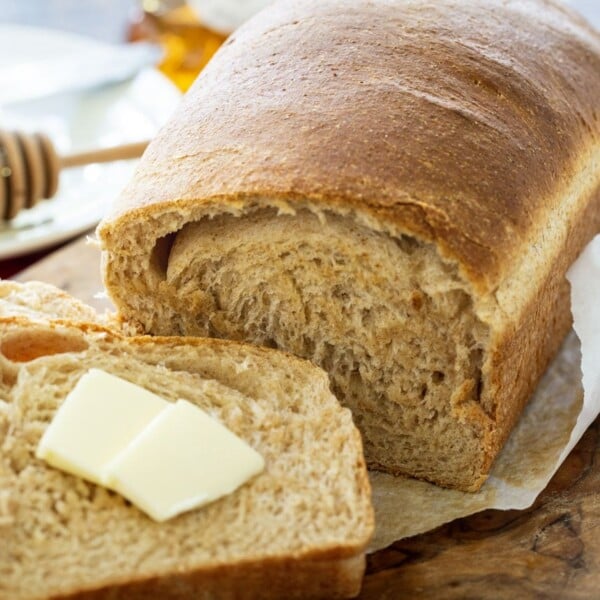 Loaf of bread with one slice cut.