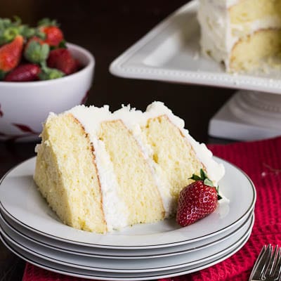 Slice of Almond Cake on it's side with a strawberry.