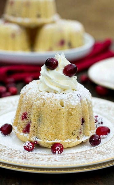 Almond Cake with Mascarpone Frosting. These festive cakes have little bursts of tartness from fresh carnberries.