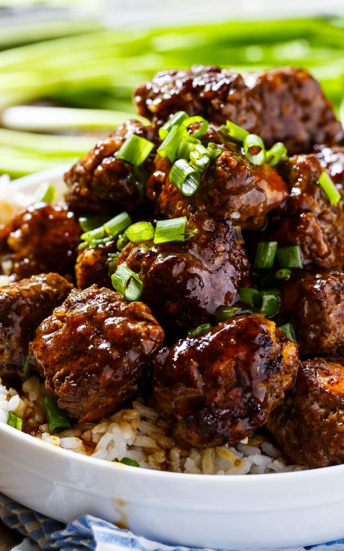 Spicy Apple-Glazed Meatballs piled up high in a bowl.