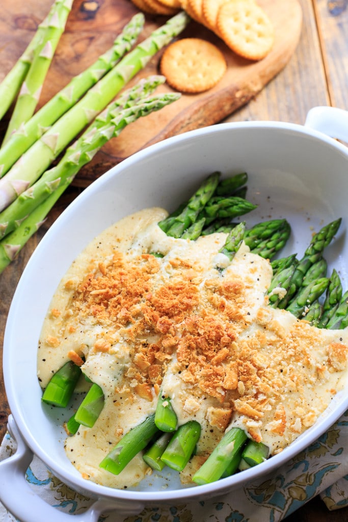 Asparagus Mornay- tender asparagus stalks covered in a cheesy sauce and crushed Ritz crackers. Perfect for Easter brunch.