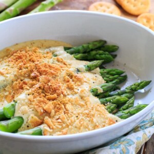 Asparagus Mornay- tender asparagus stalks covered in a cheesy sauce and crushed Ritz crackers. Perfect for Easter brunch.