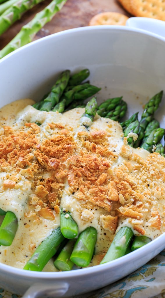 Asparagus Mornay- tender asparagus stalks covered in a cheesy sauce and crushed Ritz crackers. Perfect for Easter brunch.