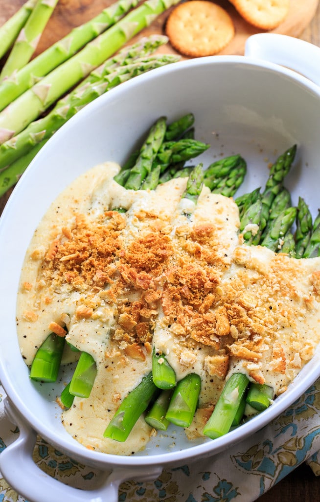 Asparagus Mornay- tender asparagus stalks covered in a cheesy sauce and crushed Ritz crackers. Perfect for Easter brunch.