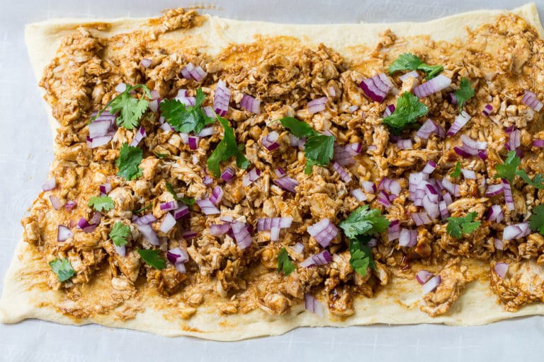 Spread crescent roll dough with bbq sauce.