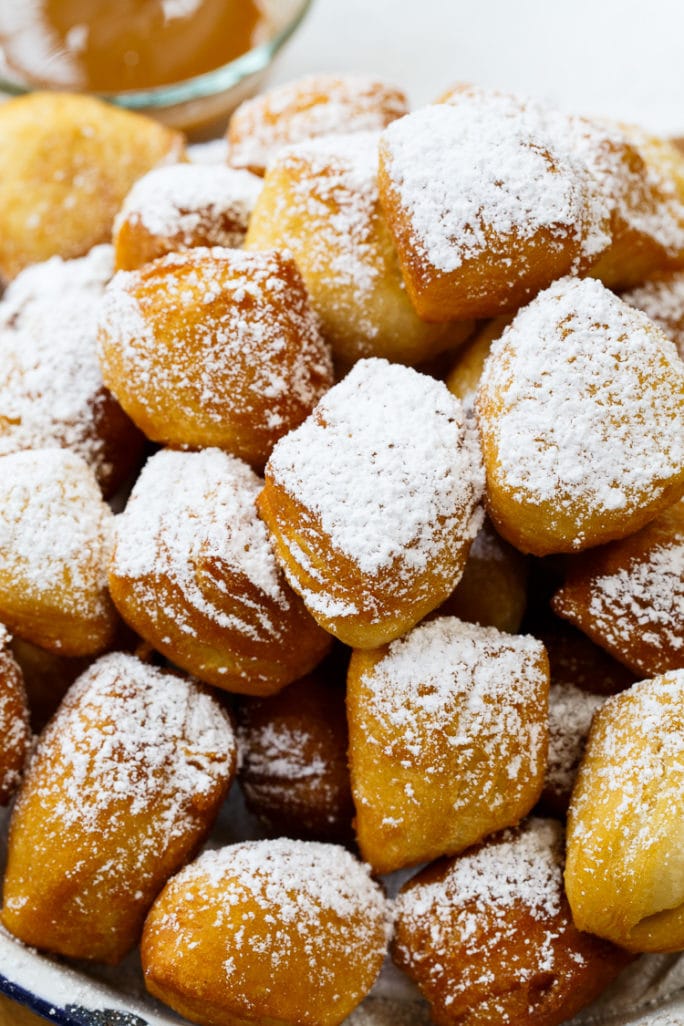 Biscuit Beignets with Praline Sauce and Caramel Sauce