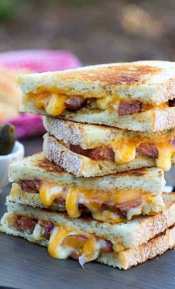 Grilled cheese halves stacked on top of each other.