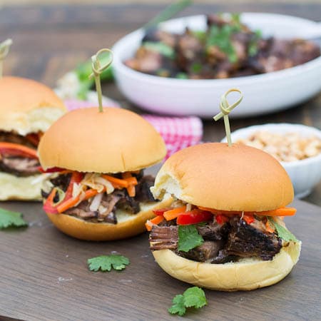 Korean Beef Sliders with bowl of beef in background.