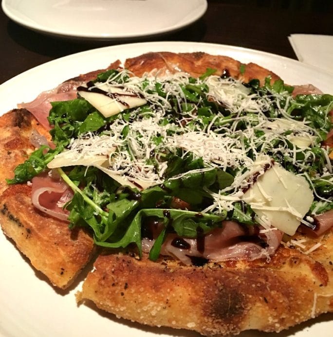New menu at Carrabba's - wood-fired pizza with prosciutto, arugula, and balsamic.