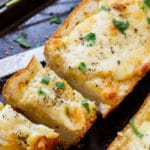 Cheesy Garlic Bread- lots of butter, mayo, garlic, and cheese make this bread insanely delicious!