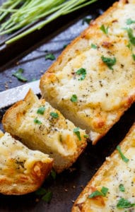 Cheesy Garlic Bread- lots of butter, mayo, garlic, and cheese make this bread insanely delicious!