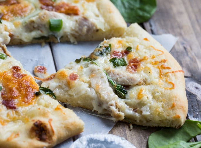 Chicken Alfredo Pizza with bacon and tons of garlic flavor.