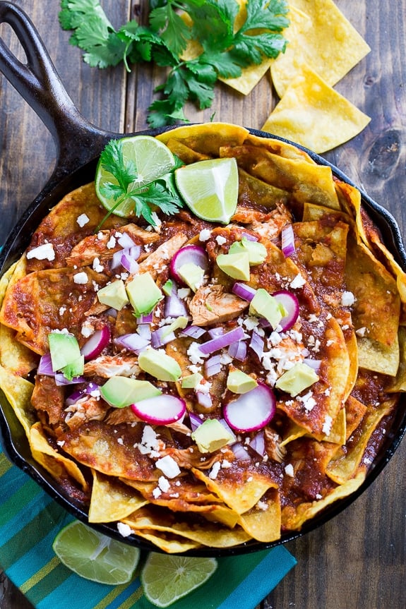 Chicken Chilaquiles with tortilla chips, chicken, red chile sauce and cotija or queso fresco cheese.