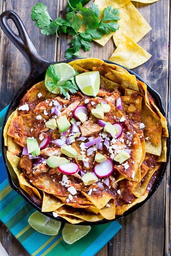 Chicken Chilaquiles with corn tortilla chips, chicken, red chile sauce, and cotija or queso fresco cheese.