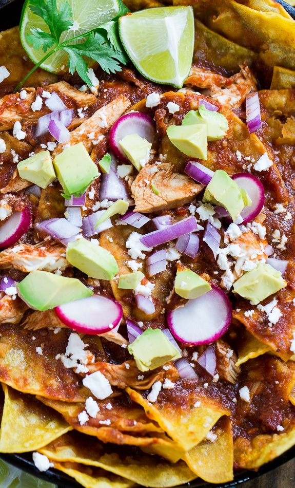 Chicken Chilaquiles with corn tortilla chips, chicken, red chili sauce, and cotija or queso fresco cheese. So good!